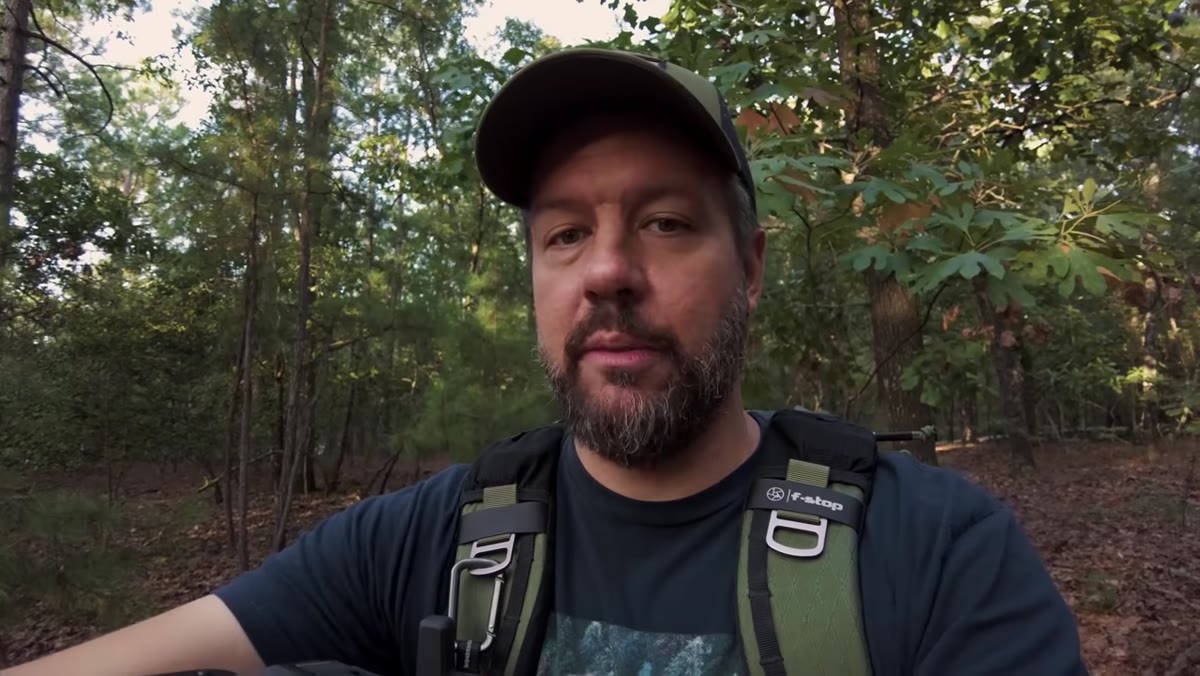 Sunlight filtering through trees behind Mark, demonstrating ideal filter conditions