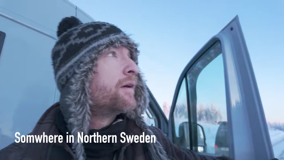 Thomas reacting to frozen trees from the van roof