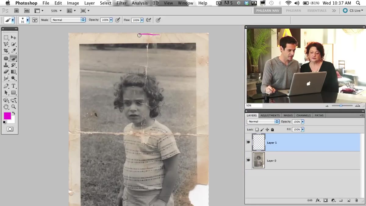 Aaron pointing out creases and a major fold in the scanned photo