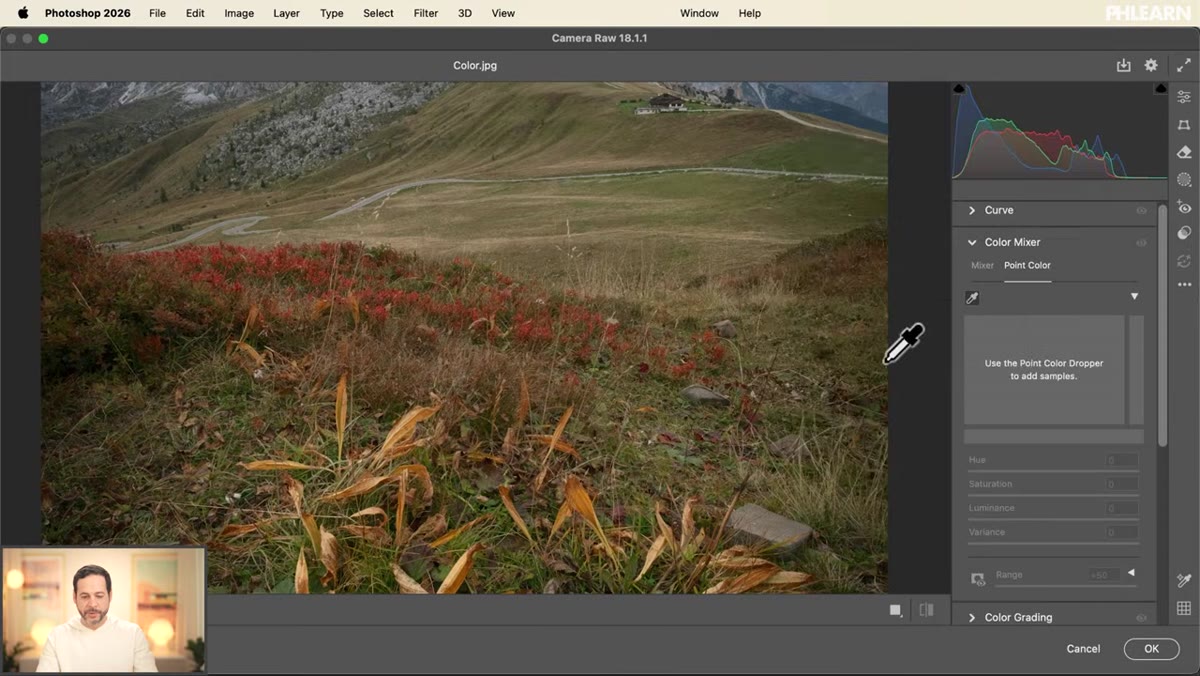 Eyedropper tool hovering over orange tones in landscape image