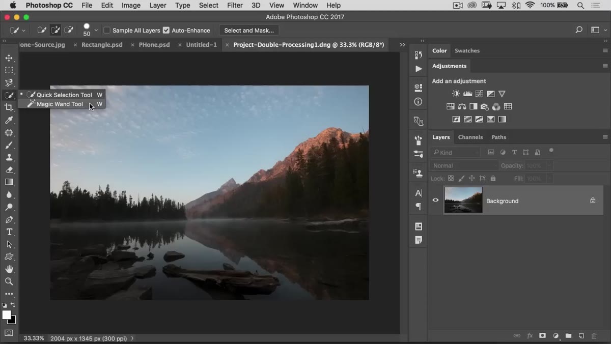 Object Selection tool drawing a loose rectangle around a subject before auto-selection snaps to it