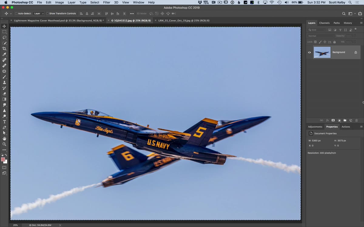 Wide photo pasted into a tall cover layout in Photoshop